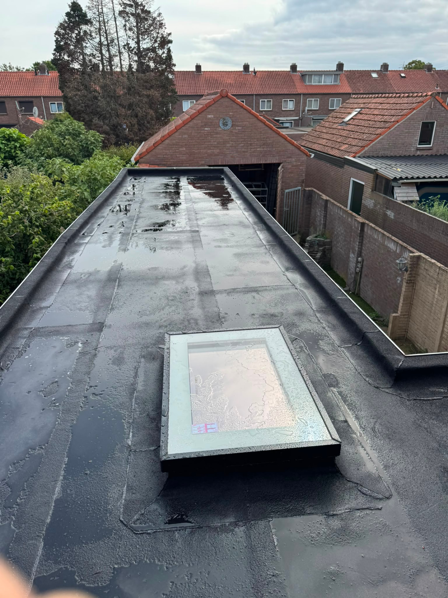 EPDM met dakraam · na regen